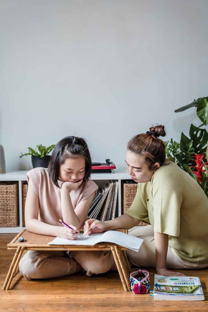 mother helping her daughter on her studies